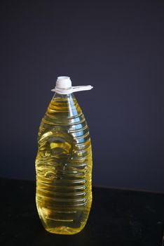 sunflower oil bottle on black background ,