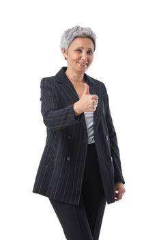 Portrait of a confident smiling senior asian business woman showing thumb up isolated over white background