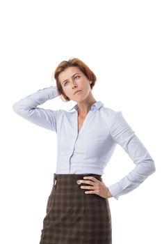 Unsure redhead business woman scratching back of head while looking up with confused unaware expression, feeling doubt or hesitating isolated on white