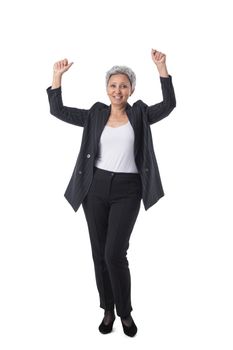 Full length portrait of senior asian business woman with arms raised isolated on white background