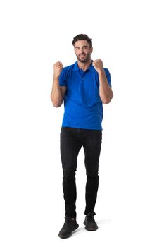 Full length casual portrait of handsome tall successful young man holding fists isolated on white background