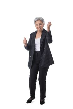 Full length portrait of senior asian business woman holding fists isolated on white background