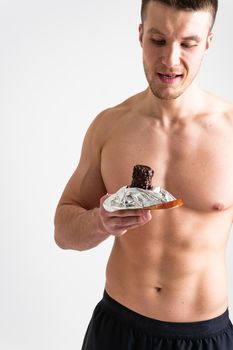 Man eats protein bar on white background isolated bar energy eat, nutrition person, isolated handsome. Sugar adult, cereal female