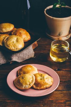 Fresh Baked Hand Pies with Blue Chives and Mushrooms on Plate