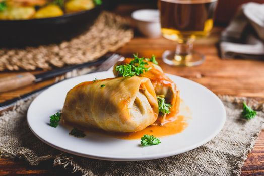 Cabbage Rolls Stuffed with Minced Beef and Rice on White Plate Served with Chopped Parsley
