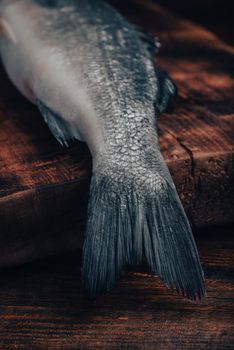 Close Up of Sea Bass Tail on Cutting Board