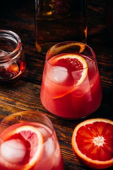 Whiskey sour cocktail with aged bourbon, blood orange juice and simple syrup