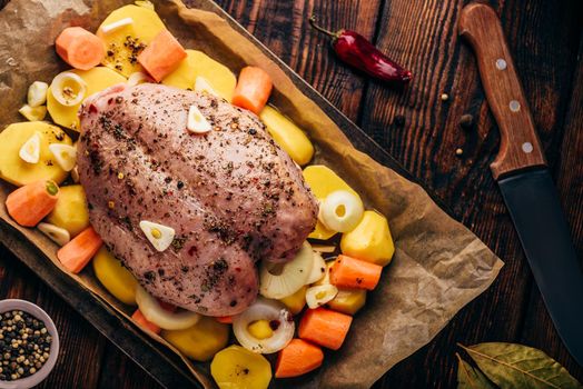 Seasoned chicken breast ready for roast in oven