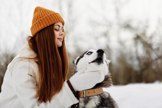 young woman with husky winter landscape walk friendship fresh air. High quality photo