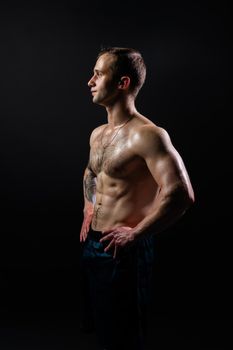 Man on black background keeps dumbbells pumped up in fitness bodybuilding athlete weight man lifting dumbbell, healthy Lift handsome adult, one fit View from the bottom up good press beautiful muscles hairy chest charisma