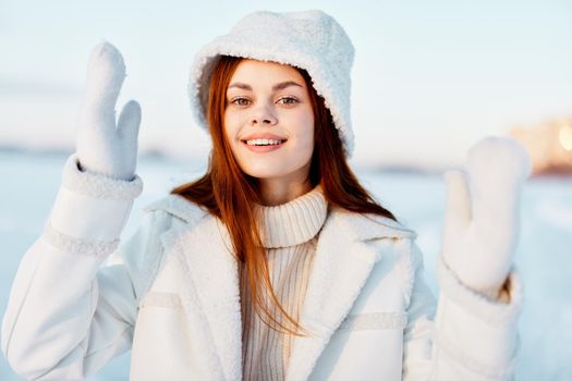 beautiful woman winter weather snow posing nature rest Fresh air. High quality photo