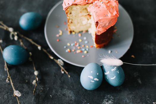 Easter cakes with decorations, colorful eggs and willow branches. Happy Easter holiday concept