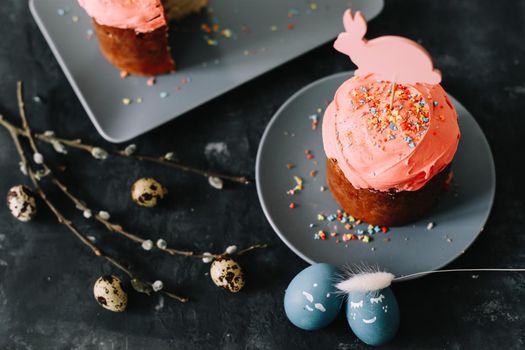 Easter cakes with decorations, colorful eggs and willow branches. Happy Easter holiday concept