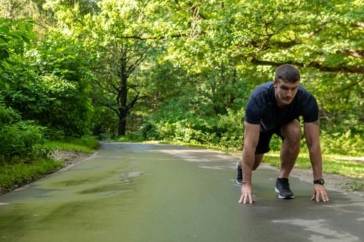 A man athlete runs in the park outdoors, around the forest, oak trees green grass young enduring athletic athlete run runner nature, fitness trail young jog, trees Autumn leisure spring, distance stretches