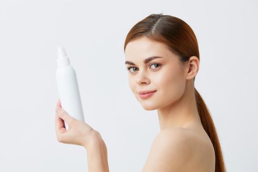beautiful woman body lotion rejuvenation cosmetics light background. High quality photo