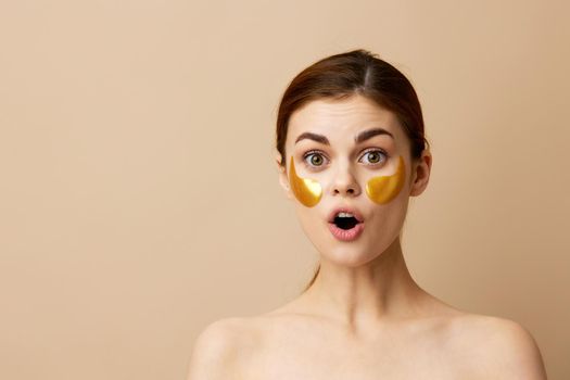 pretty woman skin care face patches bare shoulders hygiene close-up Lifestyle. High quality photo