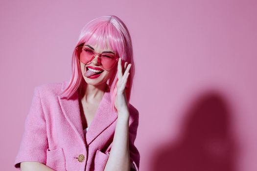 Beauty Fashion woman in pink glasses cosmetics glamor emotions color background unaltered. High quality photo