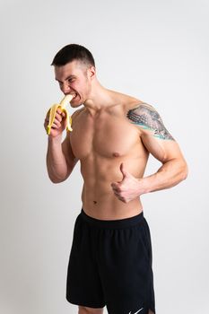 Man holds apples in fitness white background isolated man body, handsome diet male muscle nude. Guy vegetarian, wellness chest