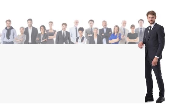 Business man with blank banner and large team of business people on background isolated on white background, copy space, for text content