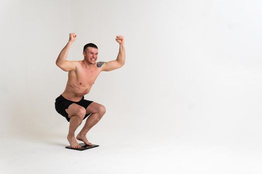 Man with weights health pondered, health and sports on a white background sore painful, backache person white young medicine, illness expression. Touching lumbar therapy, problem suffer attractive