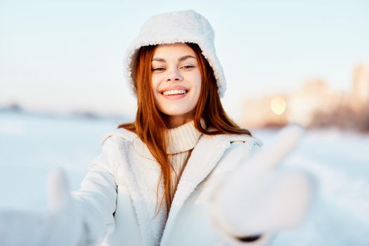 woman smile Winter mood walk white coat nature. High quality photo