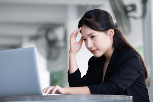 Concept Burnout Syndrome. Business Woman feels uncomfortable working. Which is caused by stress, accumulated from unsuccessful work And less resting body. Consult a specialist psychiatrist