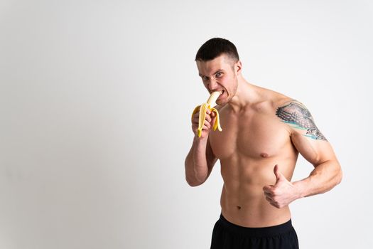 Man holds apples in fitness white background isolated man health, handsome fruit strong athlete, caucasian person. Exercise energy bodybuilder chest