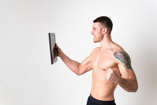 Man with weights health pondered, health and sports on a white background ache sore painful, backache person caucasian young muscular chronic. Tension neck disease suffer attractive