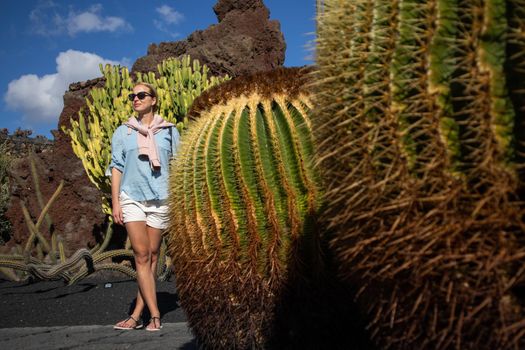 Female tourist sightseeing at tropical cactus garden in Guatiza village, Lanzarote, Canary Islands, Spain