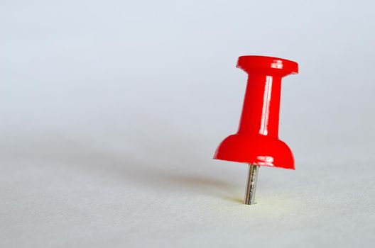 Red push pin. Closeup photography of red thumbtack.