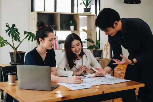 Group of young asian business financial team work together in project brainstorm meeting. Cooperate teamwork, strategy planning, small business startup company, or office coworker concept