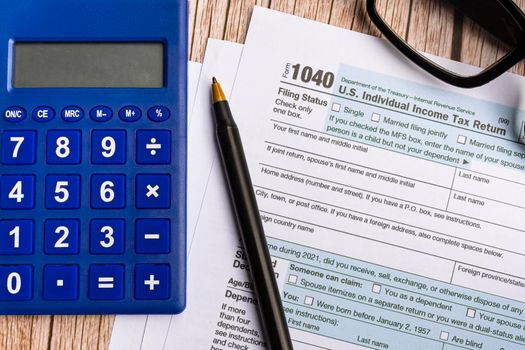 Tax forms 1040. U.S Individual Income Tax Return on a desk. Business and tax concept.