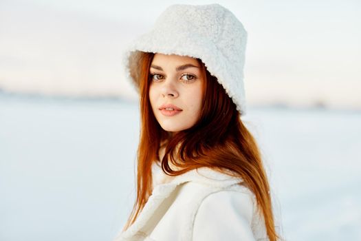 young woman red hair snow field winter clothes Lifestyle. High quality photo
