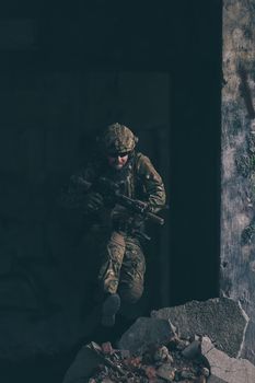 A bearded soldier in the uniform of special forces in dangerous military action in a dangerous enemy area. Selective focus. High-quality photo