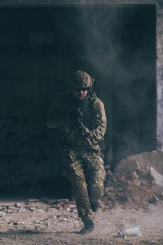 A bearded soldier in the uniform of special forces in dangerous military action in a dangerous enemy area. Selective focus. High-quality photo