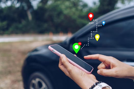 Woman use smartphone to look up map plan route for travel. Road trip concept.