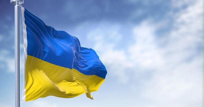 Detail of the national flag of Ukraine waving in the wind on a clear day. Democracy and politics. Patriotism. Selective focus.