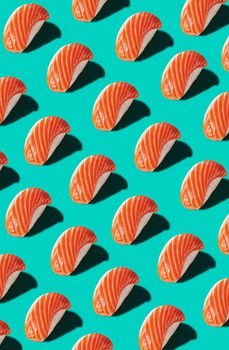 Colorful seamless pattern of traditional Japanese nigiri with raw salmon isolated on turquoise blue background. Authentic cuisine concept