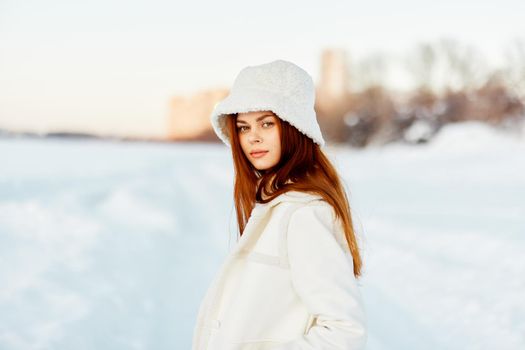 beautiful woman red hair snow field winter clothes Fresh air. High quality photo