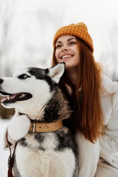 woman with a purebred dog on the snow walk play rest Lifestyle. High quality photo