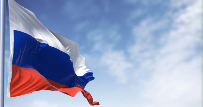 Detail of the national flag of Russia waving in the wind in a clear day. Democracy and politics. Largest country in the world. Selective focus. Seamless Slow motion. Chroma key