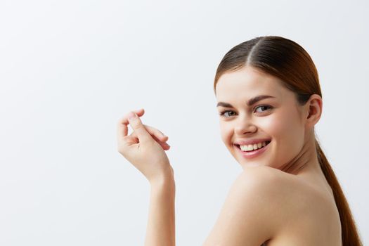 woman smiling woman bare shoulders clean skin charm isolated background. High quality photo