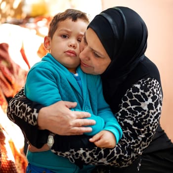 Shot of a grandmother hugging her grandson.