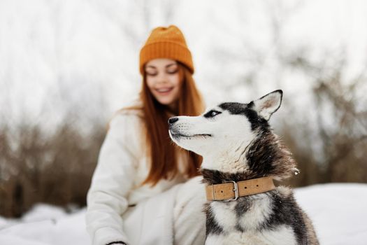 woman with dog winter walk outdoors friendship winter holidays. High quality photo