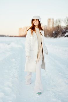 beautiful woman winter clothes walk snow cold vacation nature. High quality photo