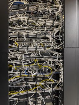 multiple server rack cables, cloud storage, indicators of different colors, lan. High quality photo