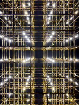 Abstract gold grid with backlight, vivid perspective symmetrical image, art deco pattern. High quality photo