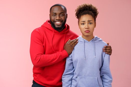 Girl unwilling participate event feel nervous insecure boyfriend encouraging hugging boost confidense assuring everything alright smiling self-assured promise everything be okay, pink background.