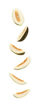 Set of some sugary green tendral melon slices in a cross-section, isolated on white background with copy space for text or images. Sweet flesh with seeds. Pumpkin plant family. Side view. Close-up shot.