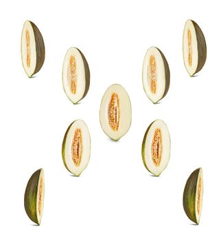 Set of some tasty green tendral melon halves in a cross-section, isolated on white background with copy space for text or images. Sweet flesh with seeds. Pumpkin plant family. Side view. Close-up shot.